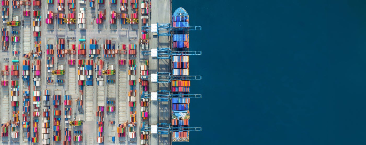 Industrial import-export port prepare to load containers.
